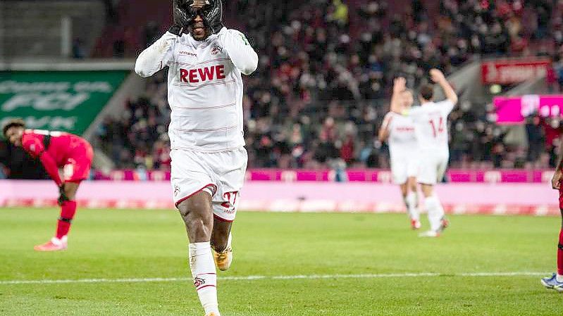 Anthony Modeste feiert seinen Siegtreffer. Foto: Marius Becker/dpa