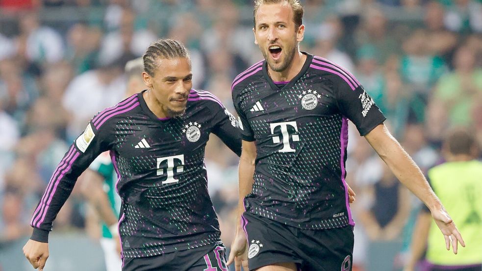 Zwei wichtige Spieler für den FC Bayern: Leroy Sané (l) und Harry Kane. Foto: Axel Heimken/dpa