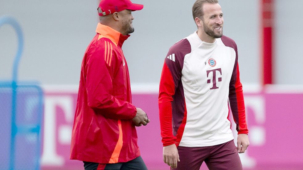 Gut gelaunt beim Training: Trainer Vincent Kompany (l) und Torjäger Harry Kane. Foto: Sven Hoppe/dpa